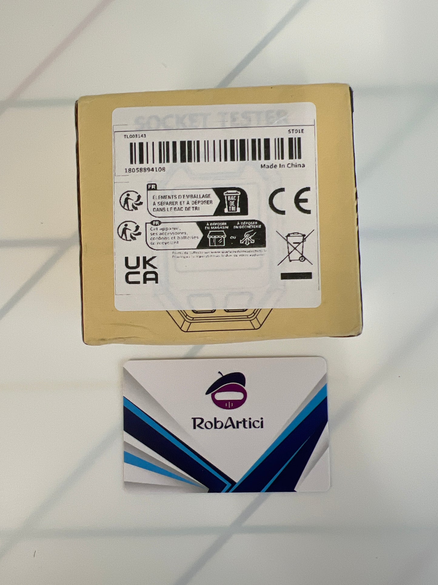 ST01E digital socket tester retail packaging showcasing product information.