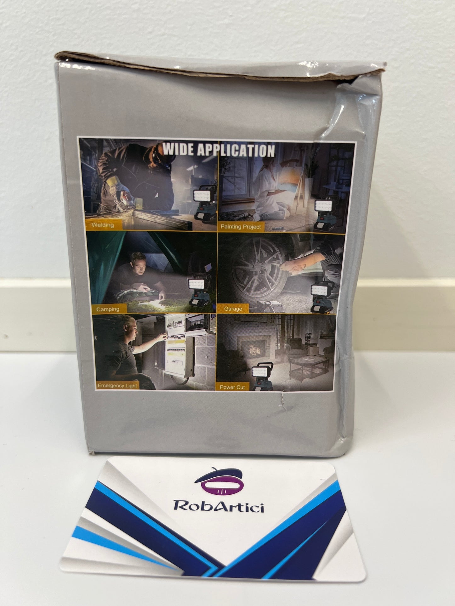 Wide application work light retail packaging showcasing product use application.