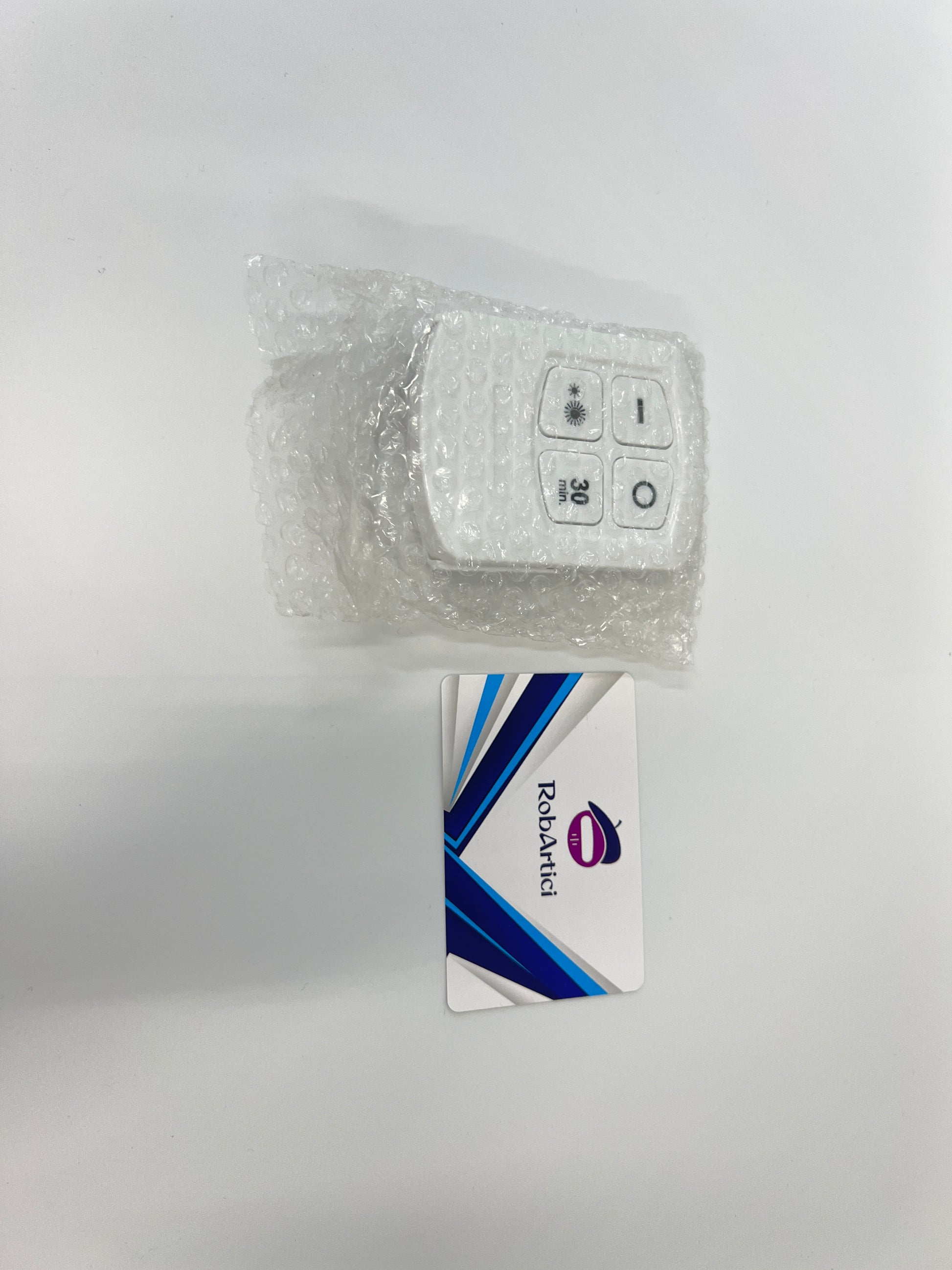 CYCG round LED light control remote showing buttons for brightness and light adjustment.