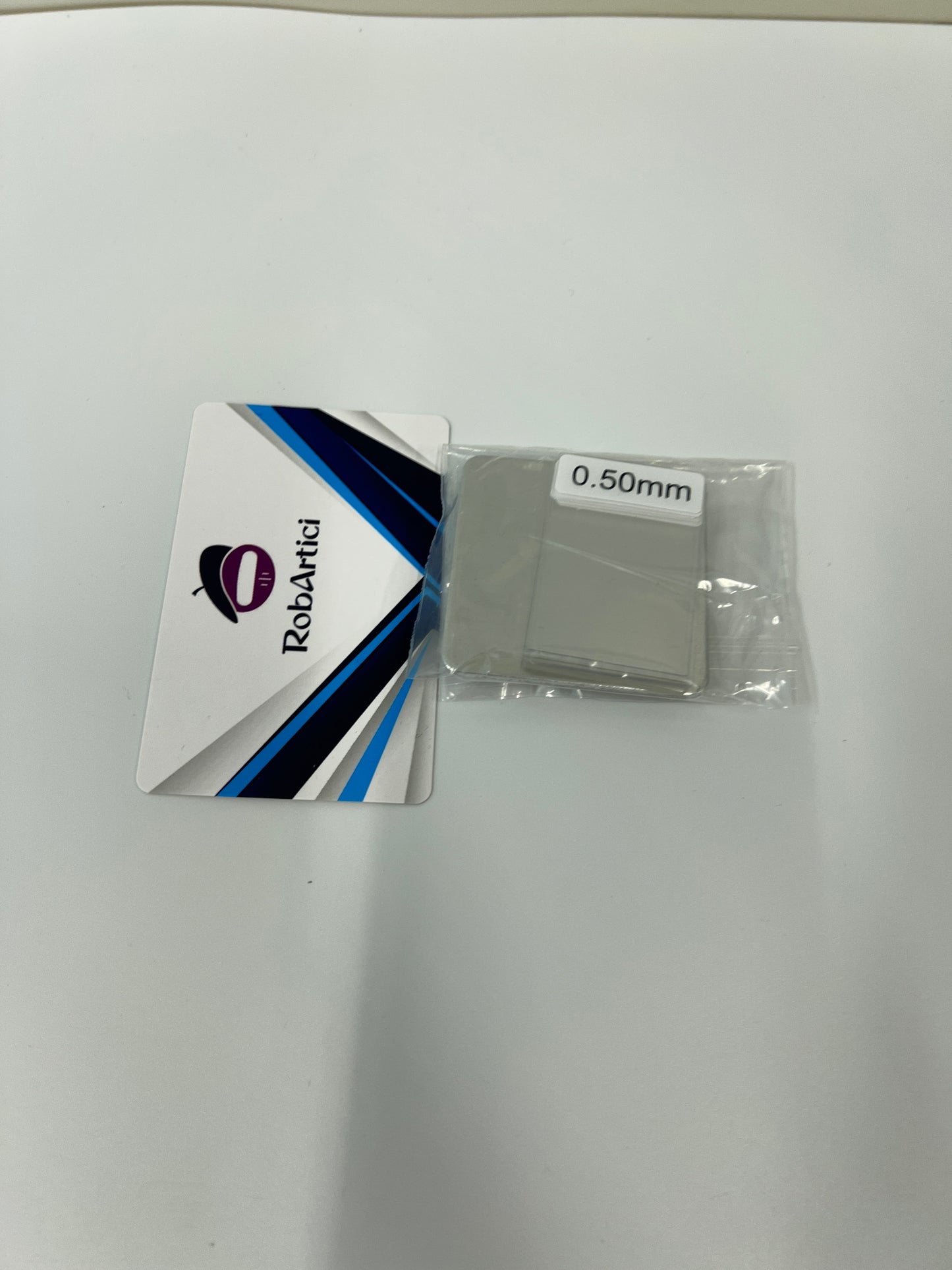 HW300PRO film thickness gauge accessory showing a 0.50mm plastic calibration standard shim.