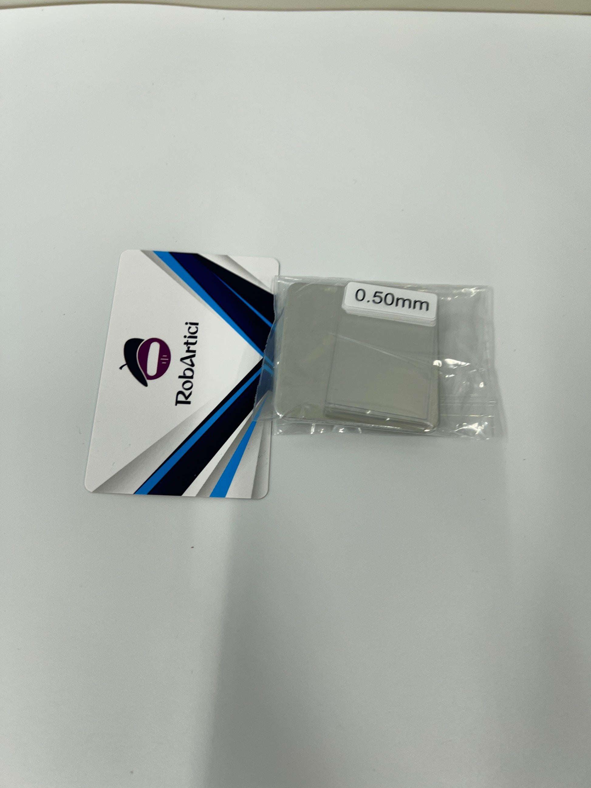 HW300PRO film thickness gauge accessory showing a 0.50mm plastic calibration standard shim.