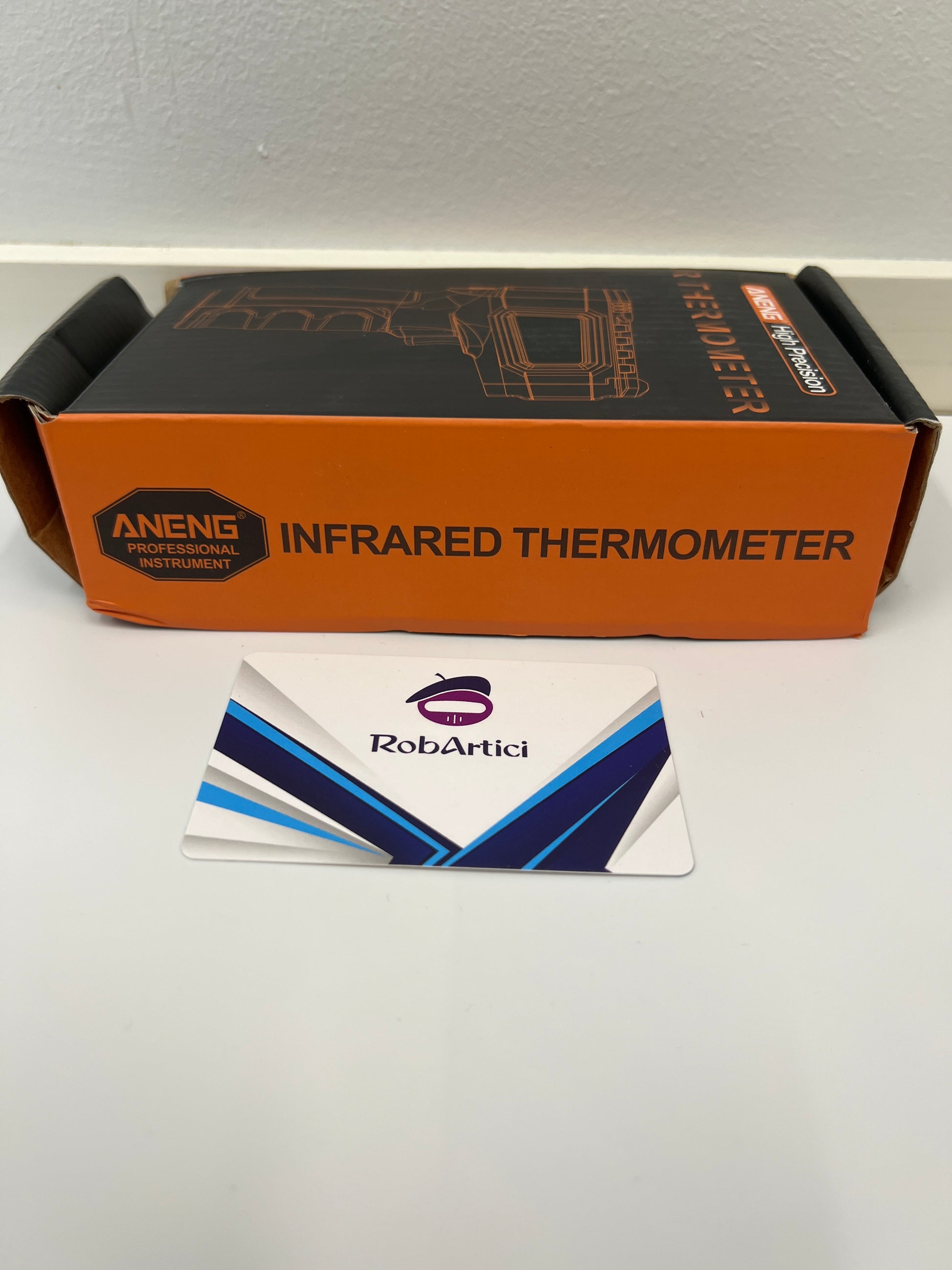 ANENG TH202 high precision infrared thermometer tool view of retail packaging.