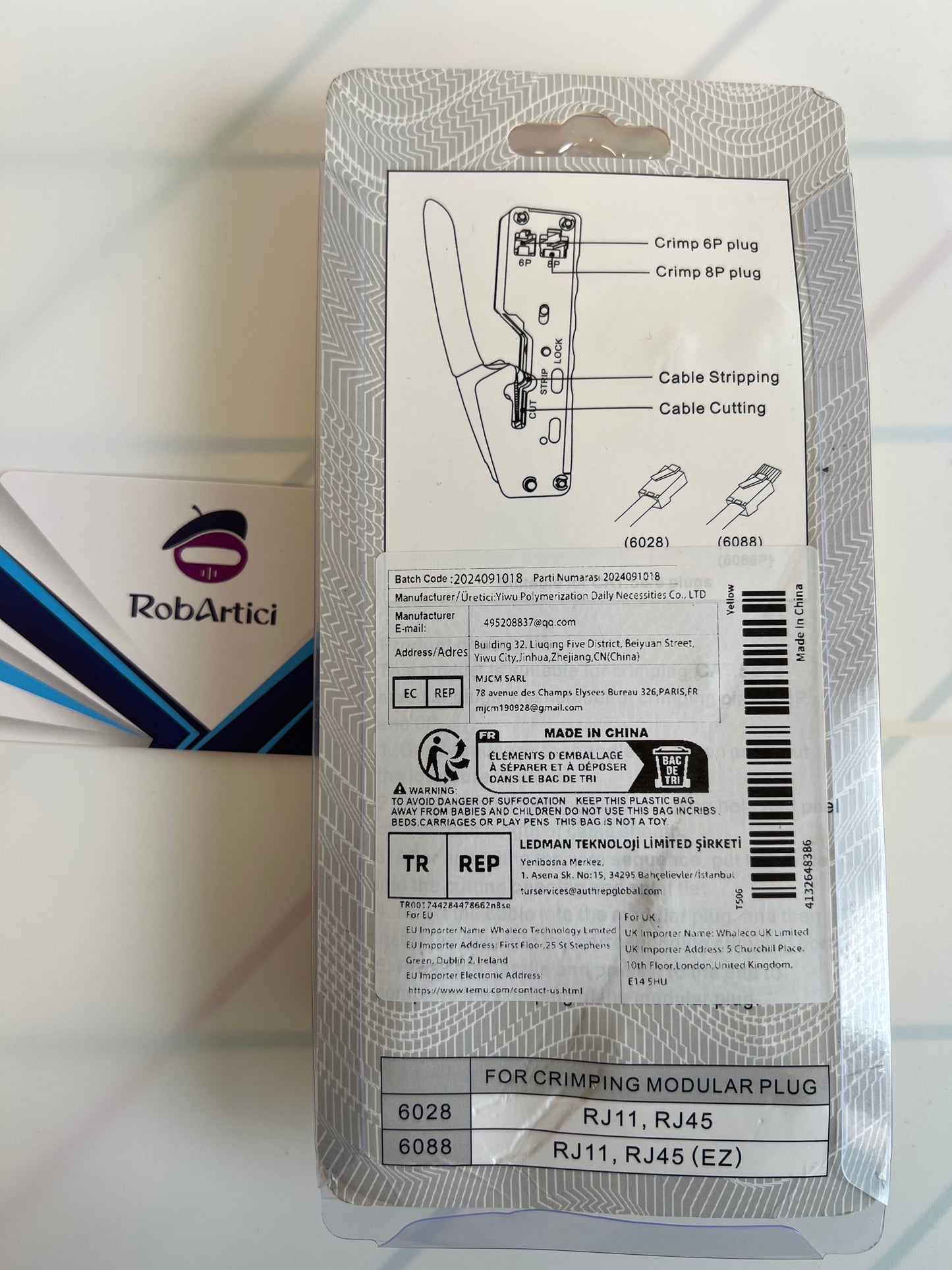 Modular plug crimper tool retail packaging showcasing product information.