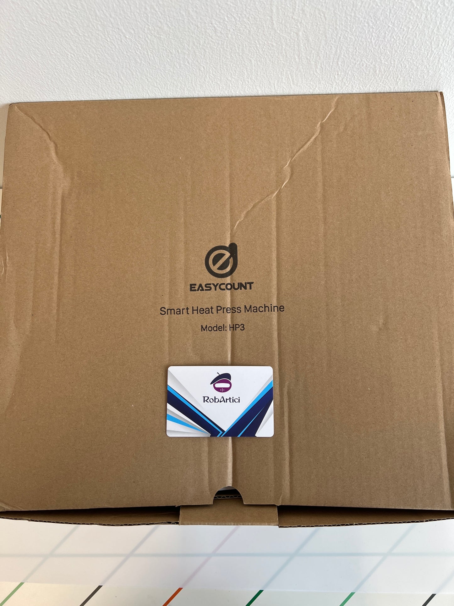 Easycount HP3 smart heat press machine retail packaging, view of top. 