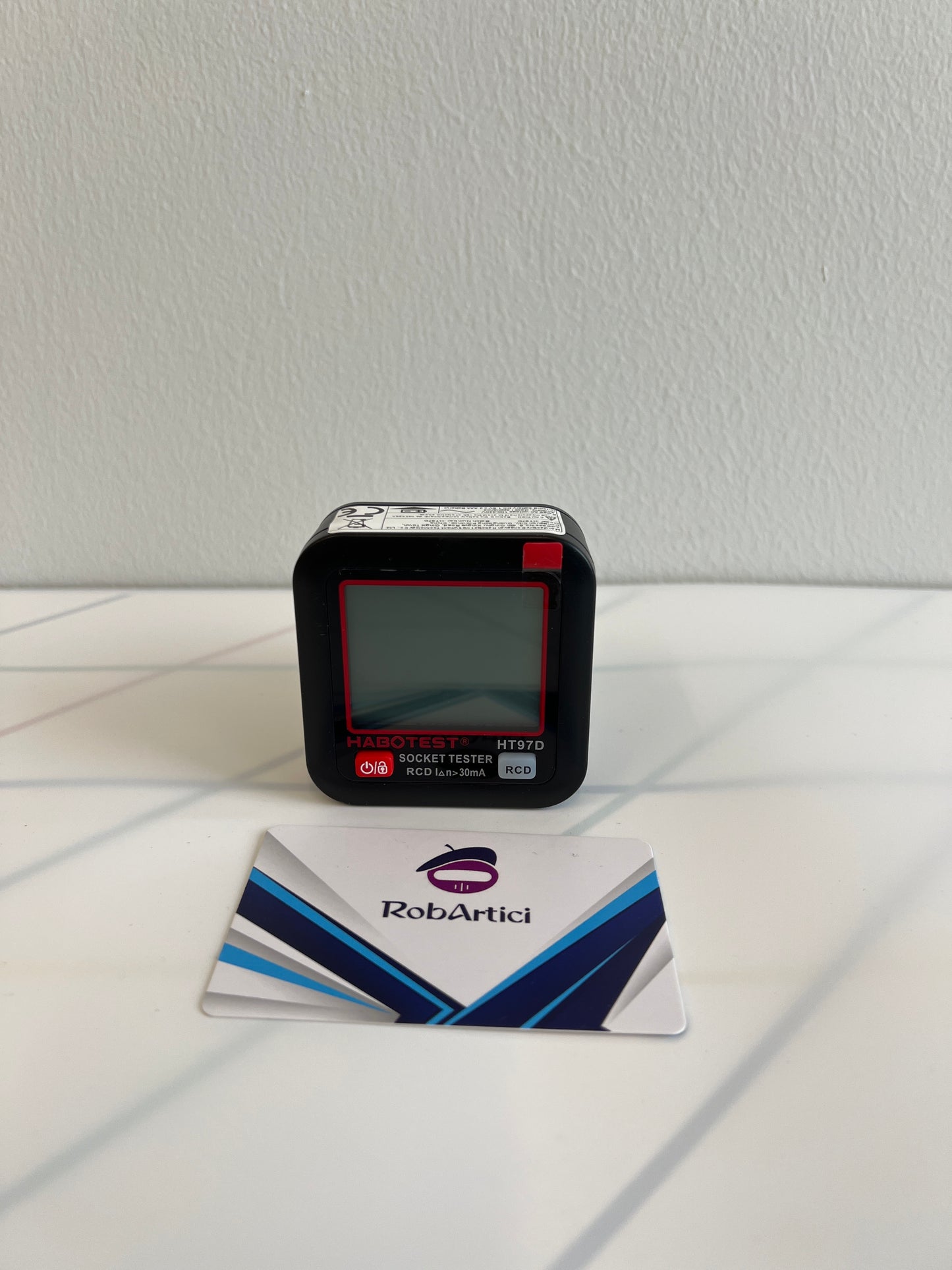HT97D digital socket tester front view, showing display monitor and control buttons. 