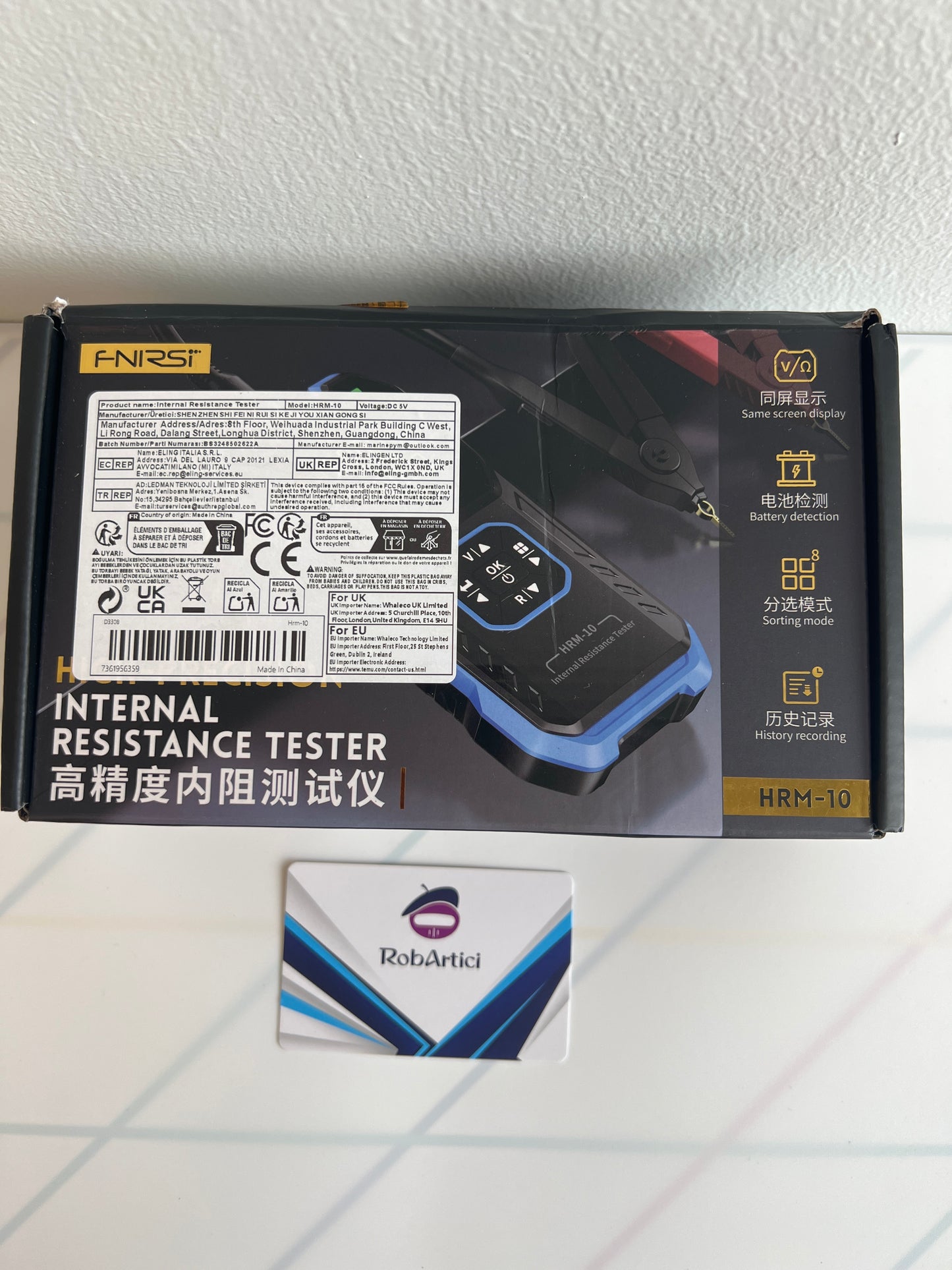FNIRSI HRM10 internal resistance tester retail packaging.