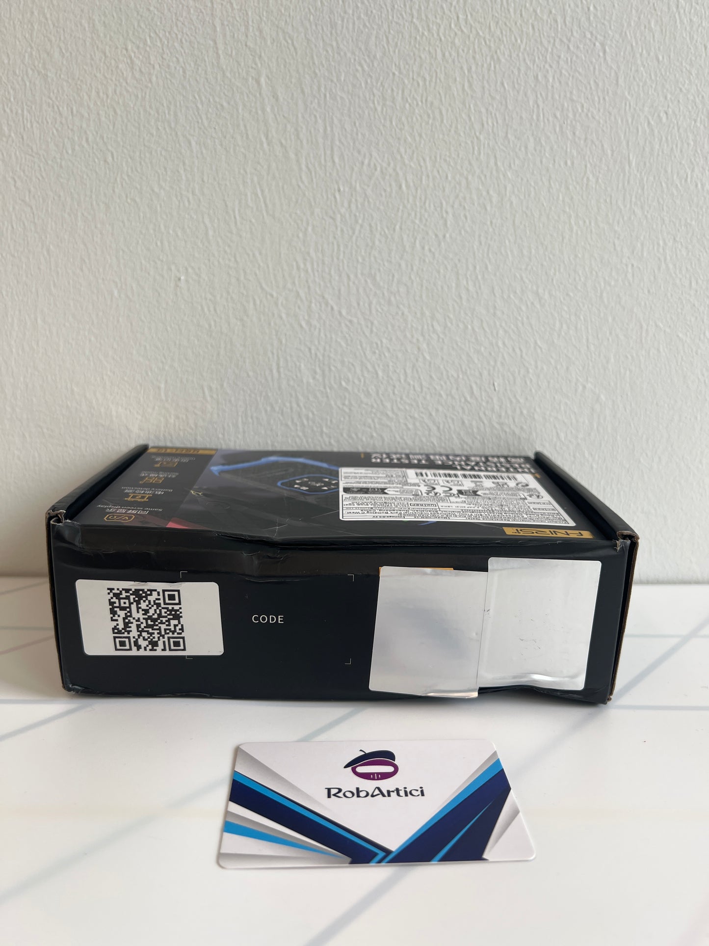 FNIRSI HRM10 internal resistance tester retail packaging.