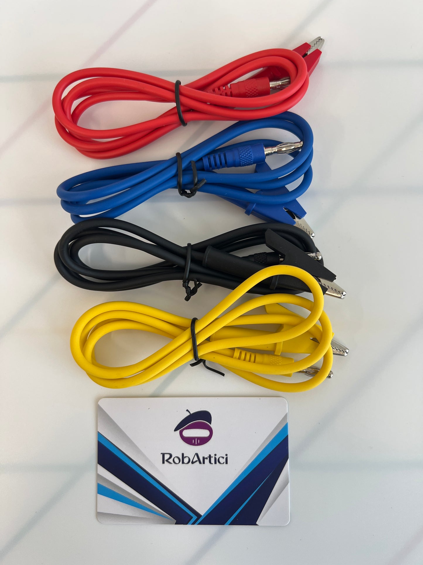 FNIRSI SG003A signal generator accessories featuring red, blue, black, and yellow test cables.