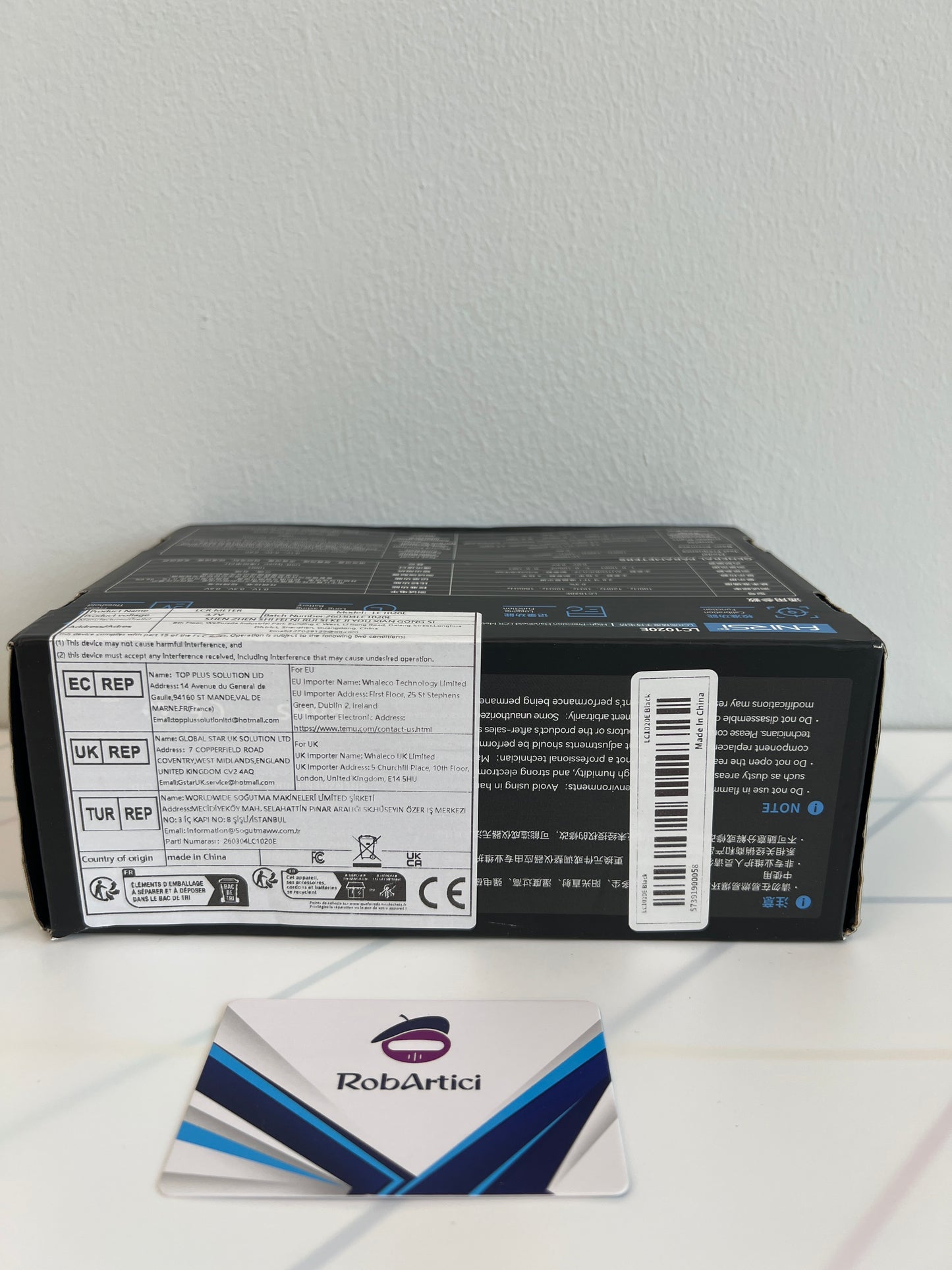 FNIRSI LC1020E handheld LCR meter retail packaging box side view with product information 