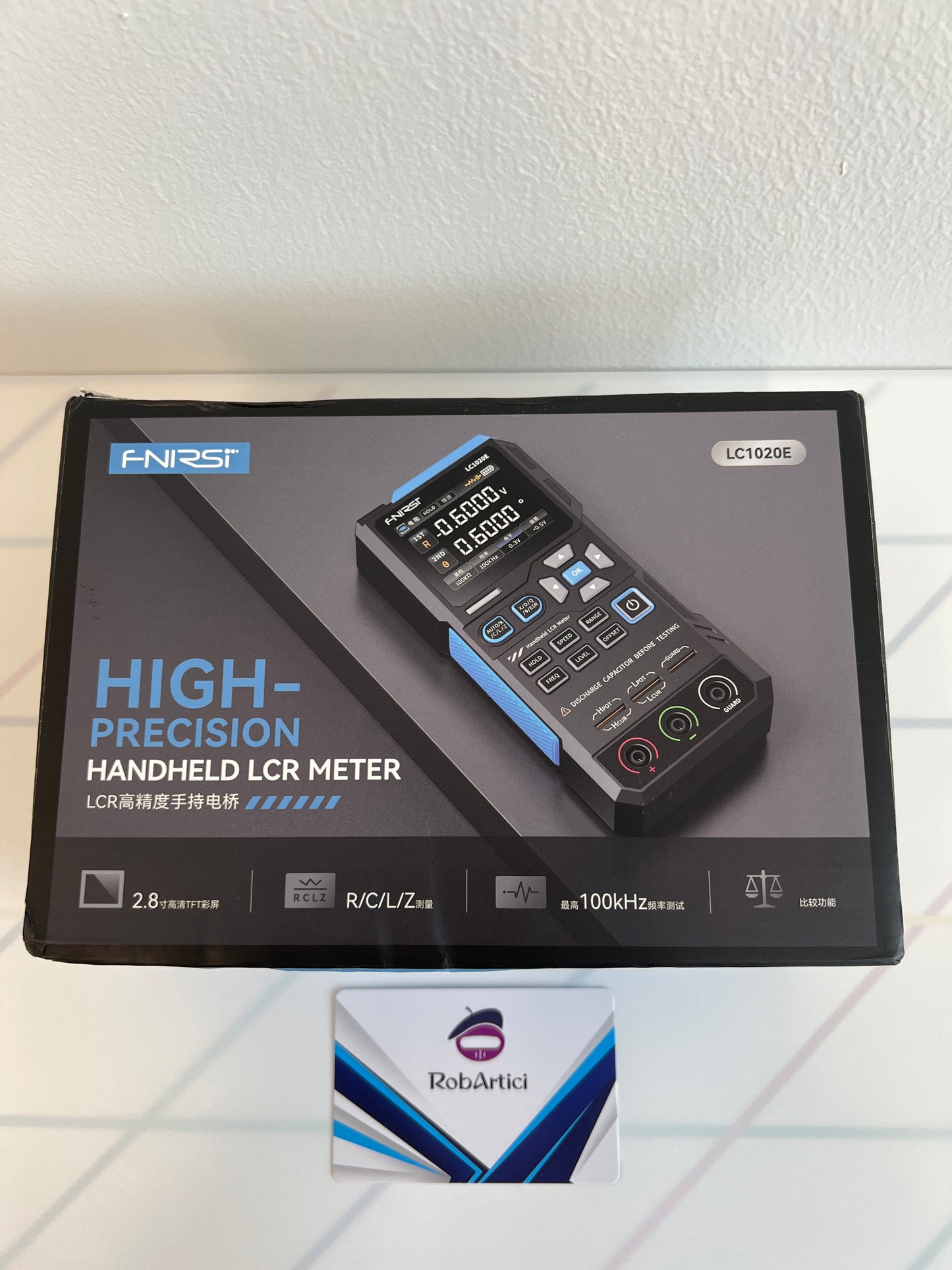FNIRSI LC1020E handheld LCR meter retail packaging box front view