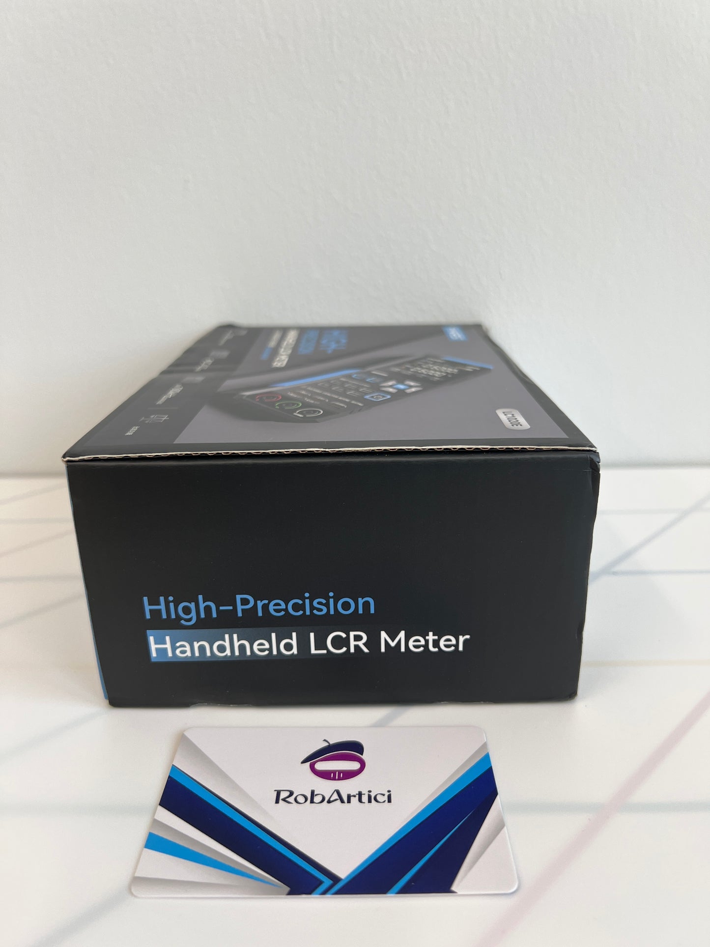 FNIRSI LC1020E handheld LCR meter retail packaging box side view
