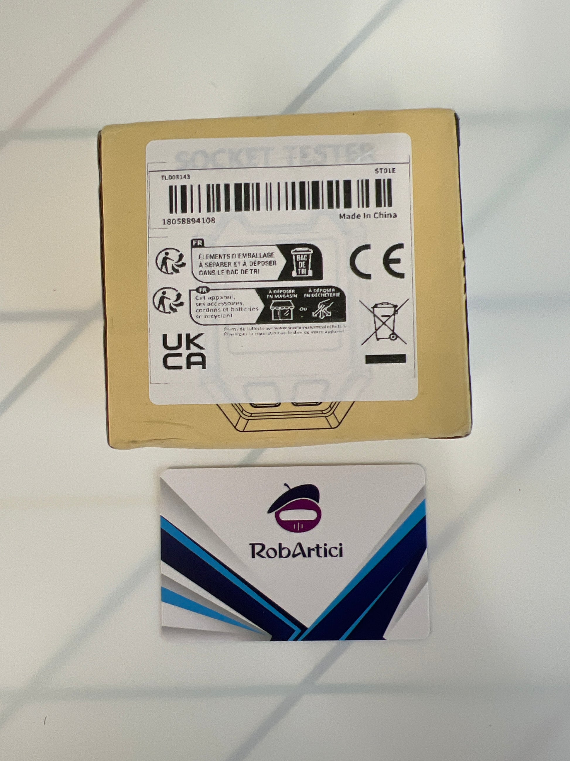 ST01E digital socket tester retail packaging showcasing product information.