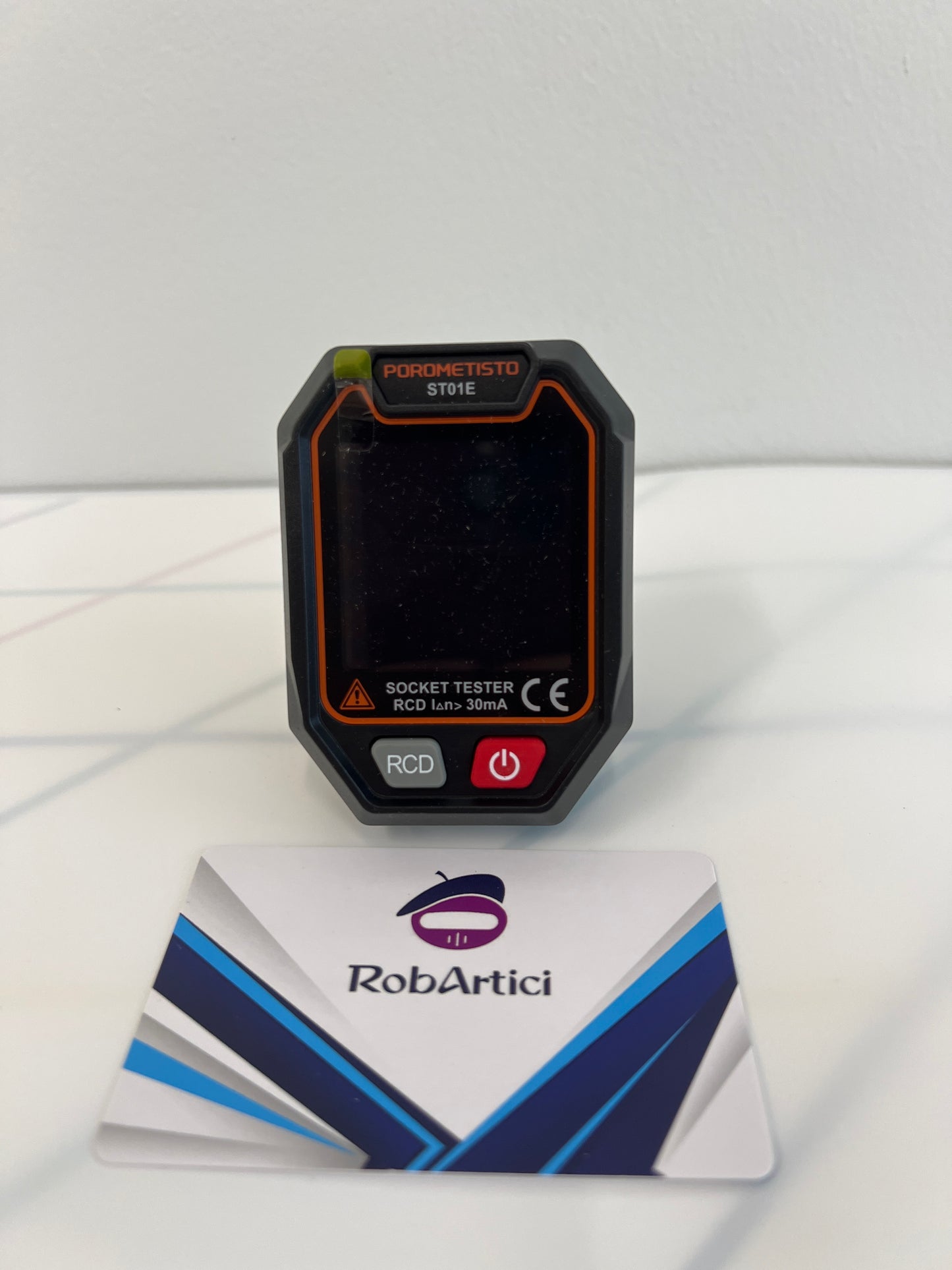 ST01E digital socket tester showcasing digital display monitor and control buttons.