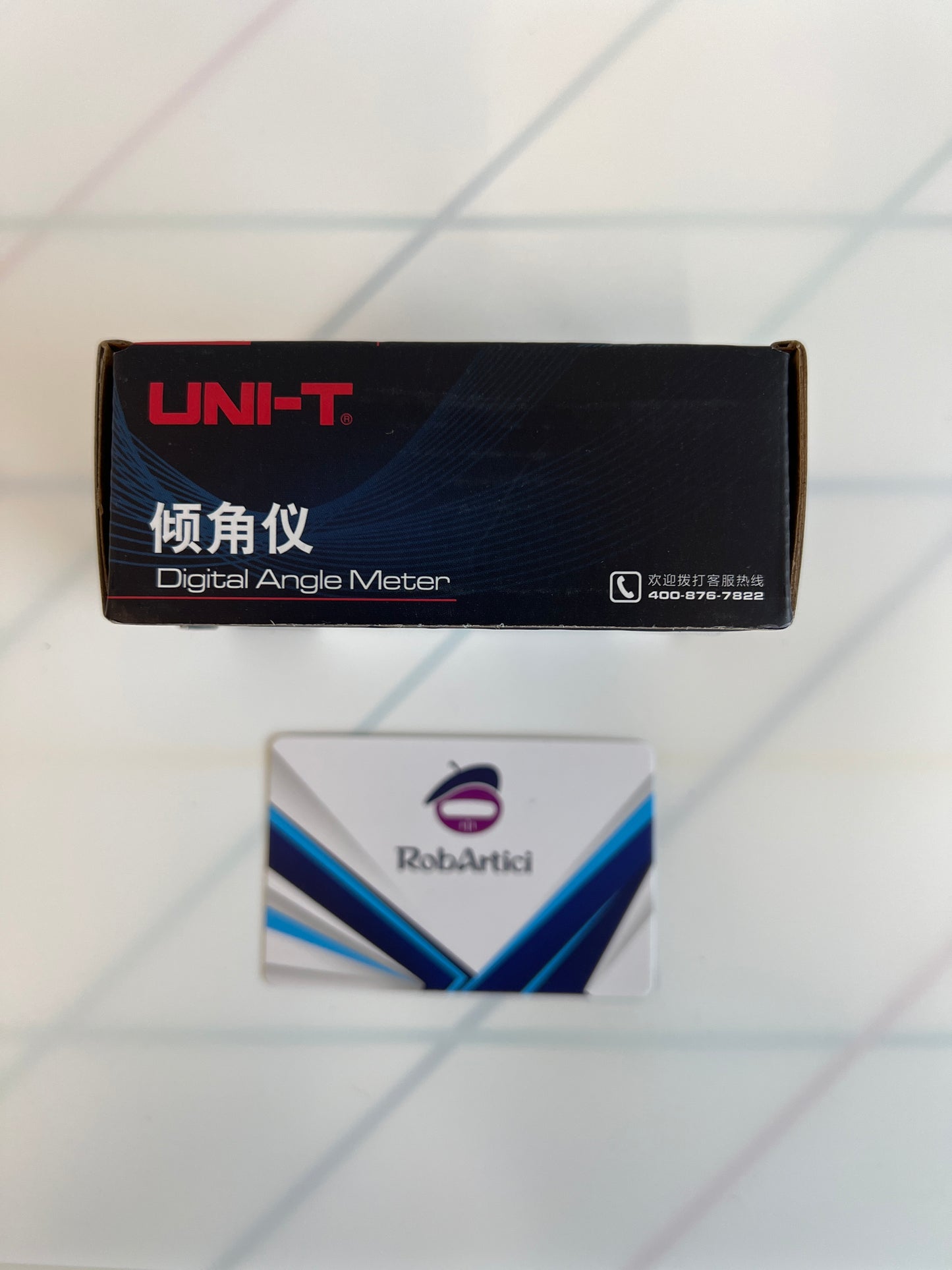UNI-T LM320C digital angle meter retail packaging.